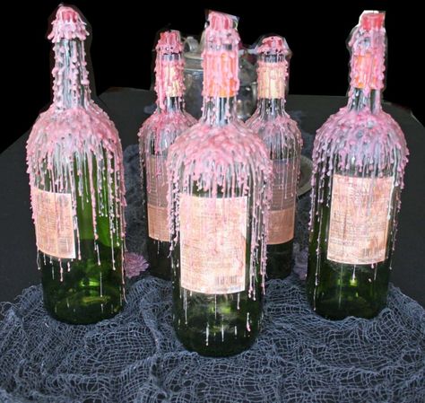 Dripped Wax Wine Bottles for Halloween - Easy DIY - Adorn the Table Non Flower Centerpieces, Candle Dripping, Patio Table Centerpiece, Drippy Candles, Melted Wine Bottles, Simple Centerpieces Diy, Pink Candle, Drawing Help, Glass Fishing Floats