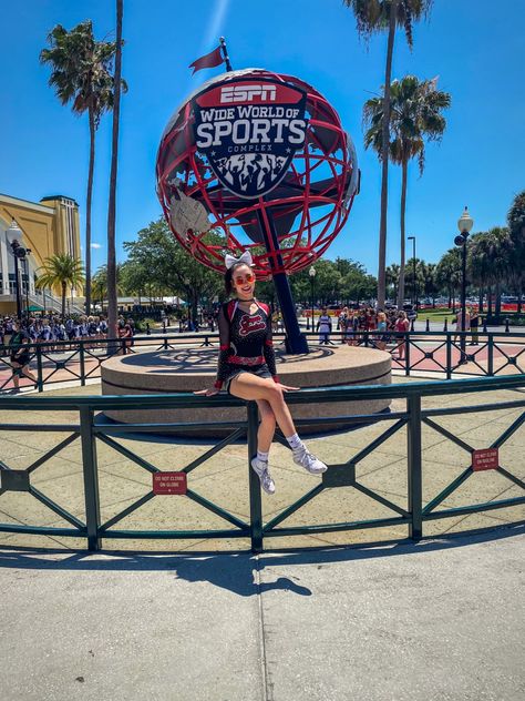 Cheerleader sitting on railing in front of ESPN globe Cheerleading Worlds, Cheer Good Luck Pins, Summit Cheer, Cheer Nationals, Allstar Cheerleading, Cheers Photo, Cute Cheer Pictures, Cheer Poses, Dance Dreams