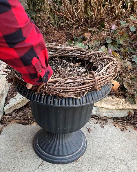 Ever wondered how to sprinkle a touch of winter magic on your porch in just 10 minutes? 🌲✨ Uncover the secrets to crafting a quick and easy winter porch pot with everyday items. Elevate your outdoor decor effortlessly and embrace the charm of the season with this speedy DIY guide! #WinterDecor #DIY #PorchPot Winter Porch Pots Christmas Arrangements, Faux Outdoor Christmas Planters, How To Make Winter Porch Pots, Christmas Porch Pots Diy, How To Make Outdoor Christmas Planters, Holiday Porch Pots Diy, Outdoor Urn Planter Ideas For Christmas, Decorate Planters For Christmas, Diy Outdoor Winter Planter