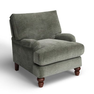 What better way to welcome traditional farmhouse charm into your living room than with a cozy armchair? This one features recessed arms and turned, tapered front legs in a warm brown finish. Integrated sinuous springs and a down + foam blend combine for comfort and support. Select from a variety of upholstery fabrics, hues, and patterns to compliment your décor scheme. Drape a throw over the back to make it even more inviting. Birch Lane™ Fabric: Nave Metal Performance Distressed Velvet Birch La Rocking Chair In Master, French Country Armchair, Modern Rustic Accent Chair, Upholstered Chairs Fabric Ideas, Oversized Armchair Living Room, Small Club Chairs, English Cottage Furniture, Comfy Farmhouse Living Room, Classical Home Decor