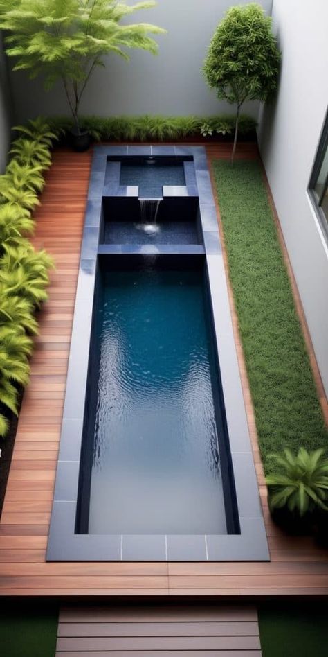 Utilize the length of your small yard by incorporating a slim, elongated plunge pool. This design leaves ample space for decked areas and lounging, making it an efficient and stylish solution for narrow outdoor spaces. Narrow Backyard Pool, Lap Pool Designs Small Yards, Narrow Pool Small Yards, Small Yard With Pool, Plunge Pools For Small Yards, Lap Pools Backyard Small Yards, Small Space Pool, Overground Pool, Small Pool Area