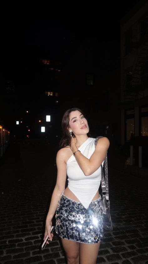 Sparkly Mini Skirt White Top Outfit Inspiration NYC Night outfit Sparkly Set Outfit, Sparkly Club Outfits, Silver Skirt Outfit Party, White Going Out Outfit, Nyc Night Outfit, Silver Sequin Skirt Outfit, Sparkly Skirt Outfit, Silver Skirt Outfits, Sparkly Mini Skirt