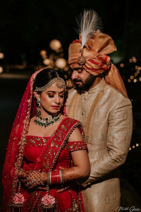 Photo of A bride in red lehenga with floral kalire ppsing with her husband on their wedding day Wedding Veils With Hair Down, Quaint Farmhouse, Photographer Poses, Bride Groom Photoshoot, Bride Groom Poses, Indian Bride Photography Poses, Indian Wedding Poses, Groom Photoshoot, Indian Wedding Photography Couples