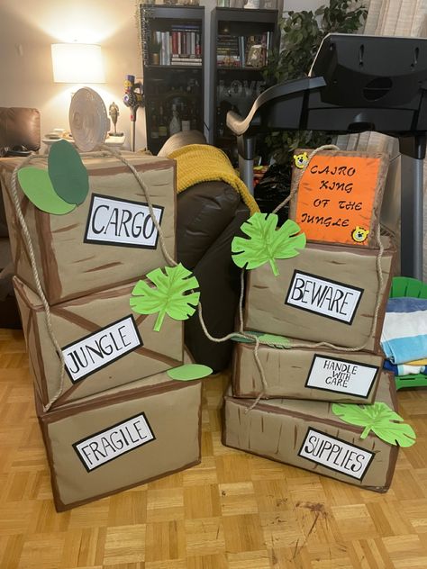 Outdoor Jungle Decorations, Jungle Student Section Theme, Cargo Boxes Safari, Safari Boxes Jungle Theme, Safari Diy Decor, Disney Jungle Cruise Decor, Safari Crates Jungle Theme, Safari Hallway Decorations, Journey Through The Jungle Vbs