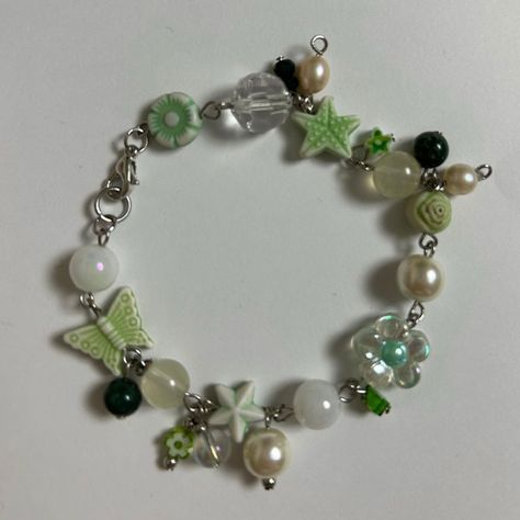 green beaded charm bracelet handmade by me (@honeybeeaded) Cute Green Jewelry, Green Diy Bracelet, Green Handmade Jewelry, Green Charm Bracelet, Green Beaded Bracelets Aesthetic, Beaded Charm Bracelets, Beaded Charm Bracelet Ideas, Handmade Charm Bracelet, Making Charm Bracelets