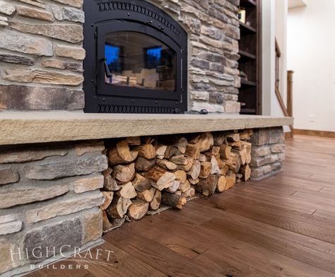 As Haley mentioned in Part 1, “We’re swimming in firewood,” and they use a wood-burning fireplace insert to help heat their home. Below the fireplace, a clever wood storage solution was created under the stone hearth. Firewood Storage Under Fireplace, Wood Stove Surround With Wood Storage, Wood Burn Fireplace, Wood Storage Under Wood Stove, Living Room Wood Burning Fireplace, Wood Burning Stone Fireplaces, Wood Burning Fireplace Hearth Ideas, Brick Fireplace With Log Storage, Wood Fireplace Wood Storage