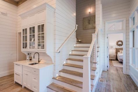 Beach Bungalow wet bar features white shaker cabinets adorned with nickel pulls and glass knobs topped with white marble fitted with a dark… Beach Bungalow, Beach Bungalows, Kitchen Design Decor, House Stairs, Pictures Ideas, Ship Lap Walls, Wet Bar, Basement Remodeling, Photos Ideas