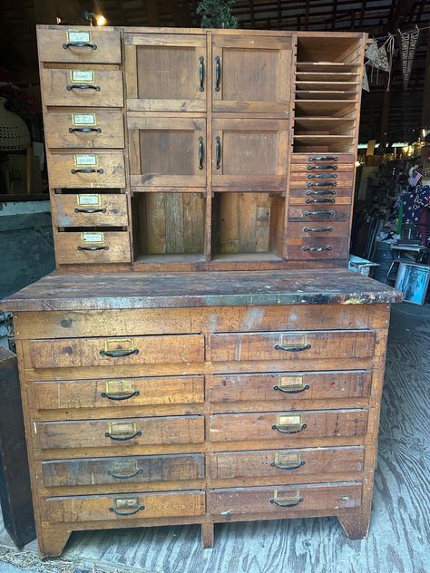 Beautiful handmade cabinet made in the early 1950's.. two pieces for easy moving. Drawers all open and close easily and are on metal drawer guides. Top right shelves and drawers are interchangeable.. drawers up top and shelves below, mix them up in a row, or leave as is with drawers on bottom. Solid back that was once barn siding with original orange paint...built for in a shop it has many open drawers and some smaller drawers have wooden dividers to keep your pieces organized. Some wear through Vintage Craft Room, Vintage Shop Display, Vintage Pantry, Old Tool Boxes, Industrial Storage Cabinets, Handmade Cabinets, Industrial Cabinet, Barn Siding, Vintage Drawer