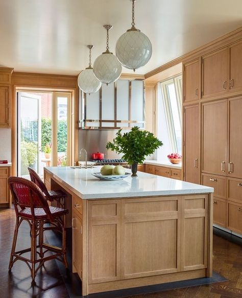 Peter Pennoyer Architects on Instagram: "The oak clad kitchen for a triplex in an historic downtown building includes a custom range hood with textured art glass and a polished nickel frame and a granite base beneath the island. Interior design: @katieridderinc; photo: @ericpiasecki #peterpennoyerarchitects #moderntraditional #kitchen" Warm Toned Kitchen, Midcentury Modern Kitchen, All Things Fall, Interior Design Business, Kitchen Inspiration Design, Kitchen Trends, New Home Construction, Fall Home, Home Construction