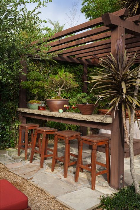 An open bar and hot tub occupy the northwest corner, where bamboo screens the yard from the neighbors. Bar On Pergola, Bar Under Pergola, Pergola With Bar Counter, Pergola With Bar Ideas, Bar Patio Ideas, Backyard Ideas With Hot Tub, Pergola Bar Ideas, Pergola With Bar, Bar Pergola