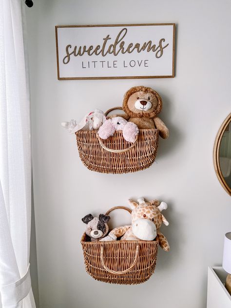 Hanging Baskets On Wall Nursery, Nursery Wall Basket Storage, Nursery Wall Baskets, Hanging Basket Nursery, Hanging Baskets For Stuffed Animals, Diy Basket Shelves, Nursery Basket Wall, Nursery Book Organization, Nursery Wall Inspiration