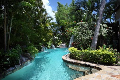 The stunning pool area is just one of the gorgeous water features the home has to offer. Just beyond the outdoor space lie wide and long waterfront… Ideas De Piscina, Bio Pool, Lagoon Pool, Pool Landscape Design, Indoor Outdoor Pool, Tropical Pool, Natural Swimming Pools, Resort Style Pool, Backyard Pool Landscaping