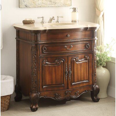 This Buckmaster 36" Single Bathroom Vanity Set is the best choice for any upscale bathroom décor. The vanity base is entirely handcrafted to perfection, intricate carving detail, and a smooth medium mahogany finish. The countertop is made of the highest quality that will resist prolonged exposure to humid conditions and long life durability. Two front doors each displaying the same decorative pattern also provide ample storage space. However, only the bottom of the front drawer is functional. To Upscale Bathroom, 36 Inch Vanity, Cream Marble, Black Granite Countertops, Victorian Bathroom, Queen Anne Style, Granite Tops, Classic Bathroom, Sink Vanity