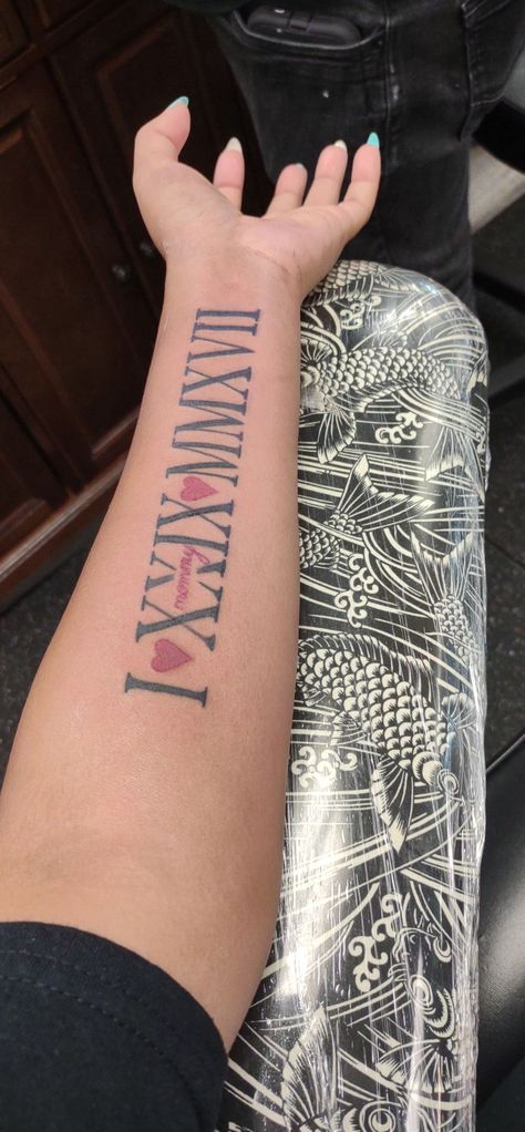 Red And Black Roman Numeral Tattoo, Roman Numeral Tattoo Inner Arm, Roman Numeral Tattoo On Arm, Numeral Number Tattoo, Arm Tattoos For Women Forearm, Cute Thigh Tattoos, Roman Numeral Tattoo, Numeral Tattoo, Inner Arm Tattoos