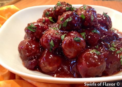 With just a few ingredients, Sweet and Sour Meatballs With Cranberry Sauce cook themselves in the slow cooker making an amazingly saucy appetizer! #swirlsofflavor #slowcooker #crockpot #sweetandsour #frozenmeatballs #easyrrecipe #holiday #gameday