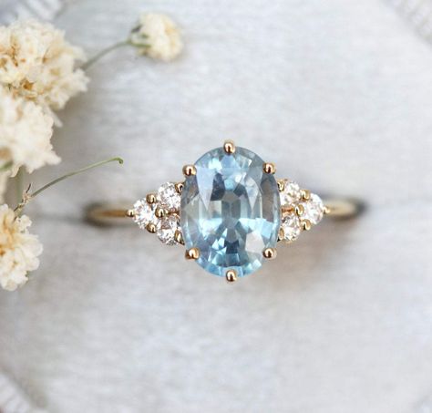 Josephine ring - https://www.capucinne.com/products/oval-blue-sapphire-engagement-ring-sapphire-diamond-engagement-ring-4971?variant=30183126040620 18k yellow gold, US 5.5; appraisal Total $3720 split in three payments Oval Engagement Ring With Round Side Stones, Oval Engagement Ring With Sapphire Side Stones, Blue Diamond Engagement Ring Vintage, Blue Stone Gold Ring, Blue Oval Engagement Ring, Wedding Rings Blue Diamond, Blue Stone Engagement Ring, Sapphire Engagement Ring Gold, Diamond And Sapphire Engagement Ring