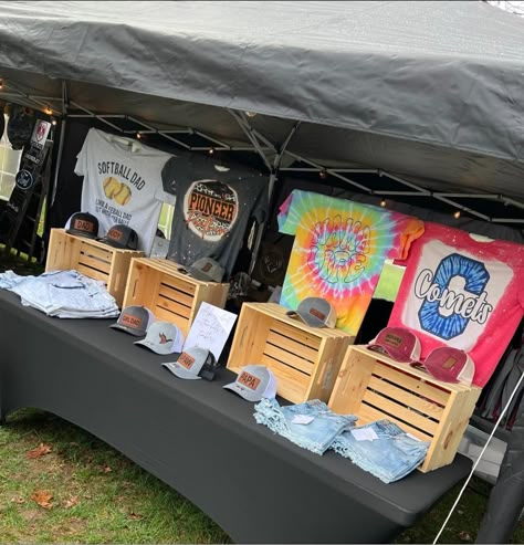 How To Display Shirts For Sale Craft Fairs, Craft Fair Shirt Display, Selling Shirts Display, Winter Wonderland Vendor Booth, Displaying Shirts At Craft Show, Shirt Vendor Display, Clothing Craft Fair Display, Music Festival Vendor Booth Ideas, Tshirt Display Ideas Booth Market