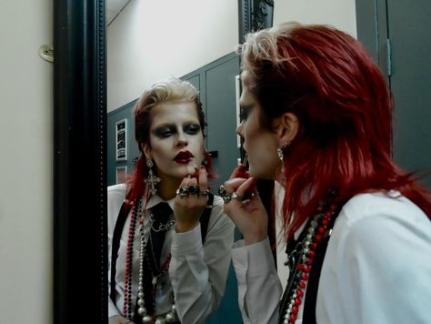 dressed to kill 📸 @gracevharper . . . . . . . . . . . #womeninsuits #blacktie #80sfashion red hair mullet wet look slicked back black tie white shirt alt alternative new wave new romantic androgynous androgyny punk goth gothic subculture 80s maximalist maximalism david bowie women in suits power suit suspenders braces chunky necklaces jewellery rings lipstick lip make up makeup mua editorial avant garde mirror pic photoshoot model modelling philosofay 80s Editorial Fashion, New Romantic Outfit, 80s New Romantic Fashion, David Bowie Photoshoot, Black Dress Shirt Outfit, David Bowie Outfits Inspiration, Black Tie White Shirt, Red Hair Mullet, 70s Goth Fashion