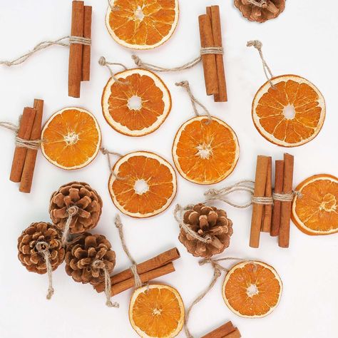 PRICES MAY VARY. Package Includes 18 dried orange slices, 8 cinnamon sticks and 10 pinecones. Pinecones measure 2.4-3.1”, orange slices are 2.0-2.8”, cinnamon sticks range from 3.1-3.9” Made with natrual materials, sliced and dried naturally with no sprays or preservatives. The delightful fragrance of citrus&Cinnamon will fill your home, creating a refreshing and inviting atmosphere. These natural christmas ornaments come with twine hangers and are ready to be hung upon your Yule tree. Natural O Cinnamon Stick Christmas Decorations, Dried Orange Christmas Decor, Christmas Tree With Oranges, Orange Cinnamon Garland, Hygge Christmas Decorations, Yule Tree Topper, Natural Xmas Tree Decorations, Christmas Orange, Cinnamon Christmas Ornaments