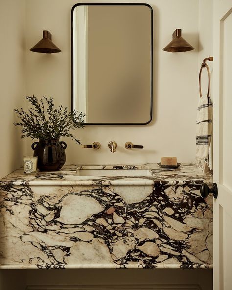 ATLANTA INTERIOR DESIGNER | The deep-fronted marble vanity in this powder bath from @beccainteriors’ Manor Park project simply melts into the design like butter… | Instagram Floating Marble Vanity Powder Room, Marble Floating Vanity, Bathroom Marble Vanity, Calcutta Marble Bathroom, Floating Marble Vanity, Floating Marble Sink, Bathroom Vanity Marble, Marble Sink Bathroom, Marble Countertops Bathroom