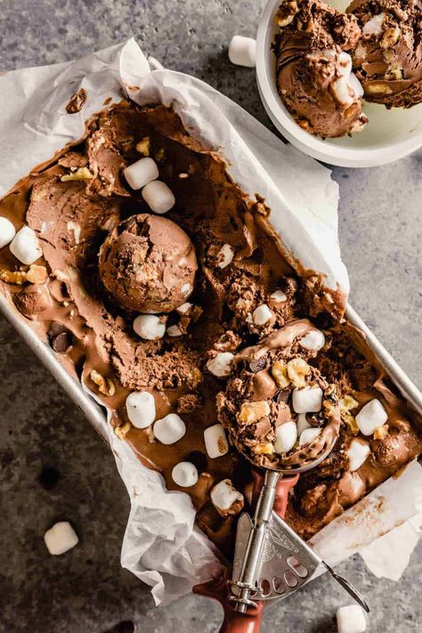 A scoop of rocky road ice cream in a bread loaf pan with an ice cream scoop at the bottom and a cup of ice cream in the top right corner. Homemade Rocky Road Ice Cream, Homemade Rocky Road, Bread Loaf Pan, Rocky Road Ice Cream, Ice Cream Base, Bread Loaf, Chocolate Ice, Rocky Road, An Ice Cream