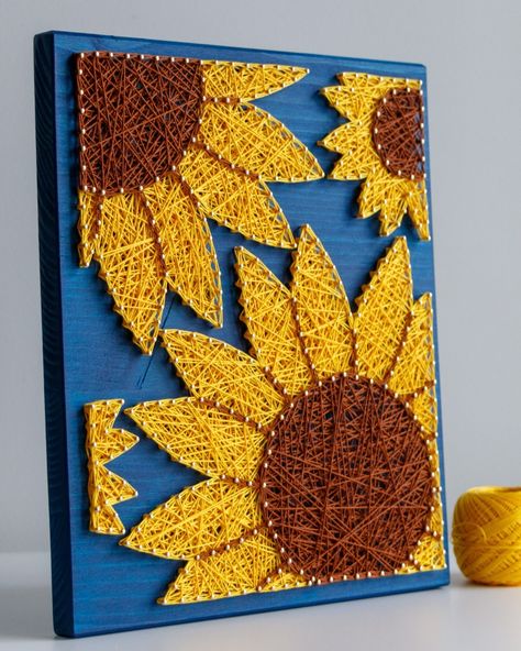 🌻 Happy Friday, everyone! 🌻 Here comes our last sunflower to rule them all - the large size! 🌻 If you ever needed a piece of sunshine in your interior, this string art sunflower will definitely bring you some! ☀️ Positive vibes while crafting and guaranteed after hanging on the wall. 🌻✨ #StringArtSunflower #PositiveVibes #BringingSunshine #StringArt #Craftkitforadults #sunflowerart Sunflower Diy Crafts, 4h Project Ideas, Zodiac Crafts, Sunflower String Art, String Art Flower, Sunflower Craft, Africa Artwork, Sunflower Crafts, Art Sunflower