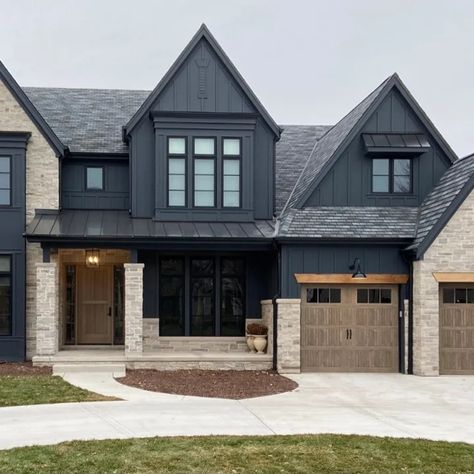 75 Stone and Metal Exterior Home Ideas You'll Love - October, 2024 | Houzz Metal Siding And Stone Exterior, Navy And Black House Exterior, Stone And Hardie Board Exterior, Stone And Siding Combinations, Dark Grey Brick House Exterior, Black And Stone House Exterior, Black Stone House, Grey Stone House Exterior, Modern Craftsman Exterior