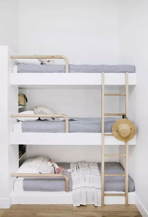 a dreamy coastal sleeping nook with a triple bunk bed, navy and white bedding, wooden ladders and a straw hat looks dreamy Bunk Bed Rooms, Shoal Bay, Triple Bunk Beds, Triple Bunk Bed, Bunk Beds Built In, Built In Bunks, Bunk Rooms, Cool Bunk Beds, Bunk Bed Designs