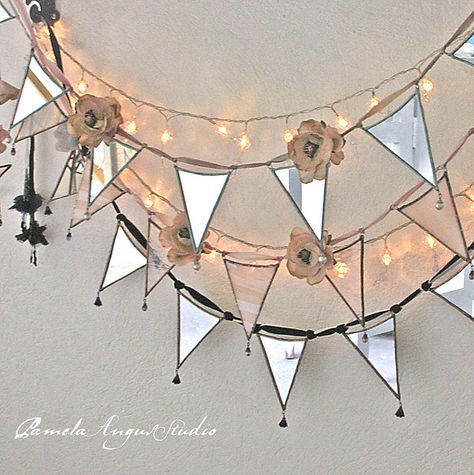 would love to make one to hang in store window- - -garlands in my atelier by pamela.angus, via Flickr Window Garland, Glass Garland, Twinkly Lights, Dorm Ideas, Cool Mirrors, Bunting Garland, Glass Garden, Pretty Lights, Glass Ideas