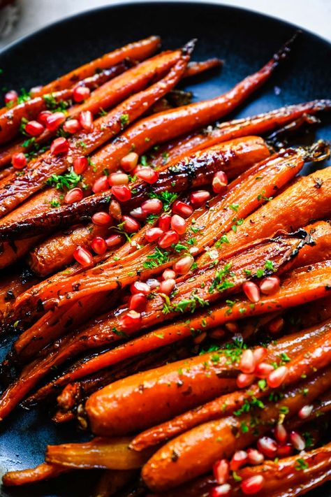 These Brown Sugar Honey Glazed Carrots are roasted to crispy, caramelized perfection, with fresh parsley, thyme and a pinch of cinnamon for fall flavor. An easy, delicious holiday side dish that everyone will enjoy. Roasted Carrot Thanksgiving, Glazed Carrots For Thanksgiving, Roasted Carrots For Christmas, Roasted Carrots Thanksgiving Recipe, Fall Roasted Carrots, Glazed Roasted Vegetables, Christmas Side Dishes Carrots, Maple Honey Glazed Carrots, Christmas Carrots Recipe