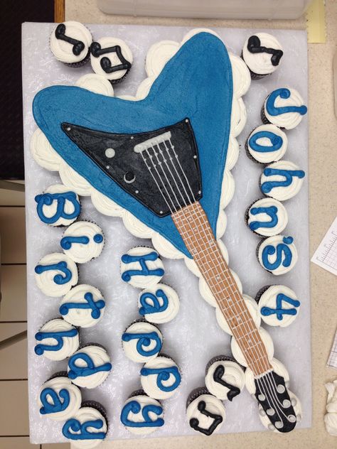 Cupcake cake for guitar lover Guitar Shaped Cake, Cupcake Guitar, Guitar Cupcake Cake, Rock And Roll Theme Party, Rock Birthday, Rockstar Party, Rock And Roll Birthday, Specialty Cupcakes, Rockstar Birthday