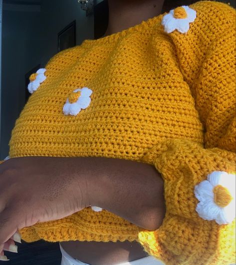 A yellow crochet sweater with puffy flowers of white and yellow on it. Crochet Sweater Aesthetic, Yellow Crochet Sweater, Flower Crochet Sweater, Cute Crochet Sweater, Crochet Sweater Ideas, Crochet Sweater Outfit, Daisy Flower Crochet, Sweater Flowers, Pattern Crochet Sweater