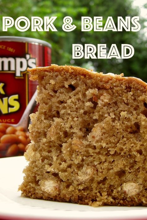 A thick slice of Pork & Bean Bread on a plate in front of a can of Pork and Beans. Pork And Bean Cake Recipe, Recipes With Pork And Beans, Pork And Bean Cake, Pork Cake, Recipes Using Pork And Beans, Pork And Bean Bread Recipe, Bean Bread, Desserts Made With Beans, Recipes Using Canned Baked Beans