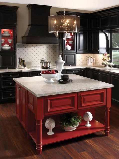 Black cabinetry is hot in a big way, and it infuses a kitchen with a hard-to-duplicate sense of mystery and glamour. But for some, all that darkness can feel heavy and oppressive. Buoy it with a shot of brilliant color, such as the red on this kitchen island. If you have open or glass-front cabinets, you can also use the same brilliant hue to brighten their insides, as seen here. Kitchen Cabinets Color Combination, Red Cabinets, Kitchen Unit, Kabinet Dapur, Two Tone Kitchen, New Kitchen Cabinets, Kitchen Cabinet Colors, Kitchen Decorating, Red Kitchen