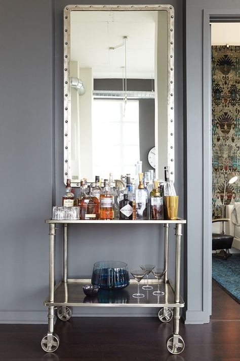 Hang an oversized mirror above a bar cart to create a focal point in a room. See all 15 CREATIVE ways to use and style a bar cart in your home. Classic Bar Cart, Bar Cart Ideas, Nailhead Sofa, Mirror Bar, Baxter Design, Cart Ideas, Home Bar Design, Wine Cellar Design, Cellar Design