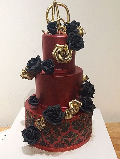 Gorgeous satin red cake with gold and black roses, black damask! Black And Red Quinceanera Cake, Wine Red Black And Gold Wedding, Red Black And Gold Quinceanera Dresses, Quinceanera Themes Red And Black, Deep Red And Black Wedding Theme, Red Black And Gold Quince Cake, Red And Black Quince Cake, Black And Red Wedding Cakes, Red And Black Sweet 16 Dresses