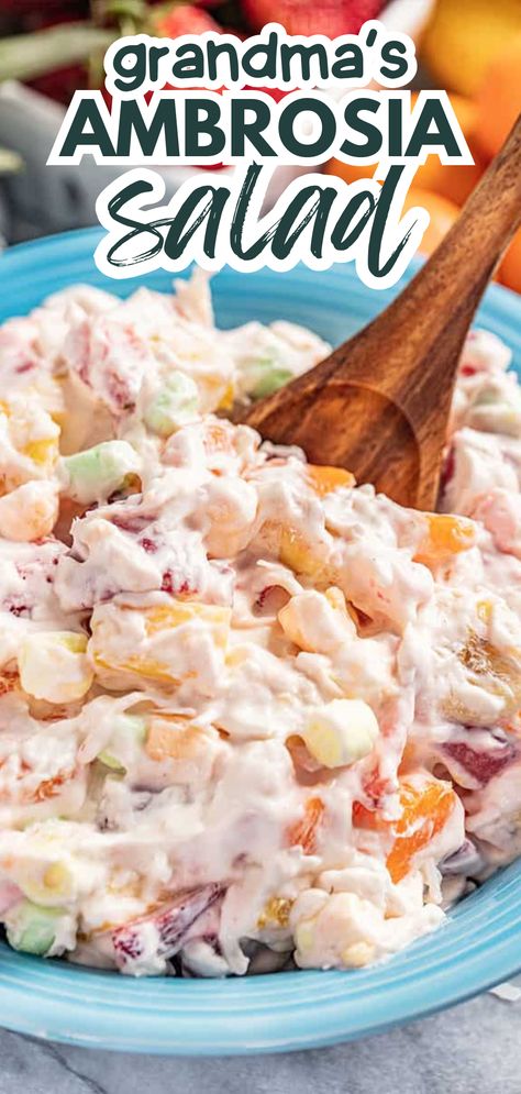 A bowl of creamy ambrosia salad. Easy Ambrosia Salad Cool Whip, Whip Cream Fruit Salad Marshmallows, Thanksgiving Marshmallow Salad, Waldorf Salad With Marshmallows, Marshmallow Fruit Salad Recipe, Ambrosia Fruit Salad With Cream Cheese, Waldorf Salad Recipe With Marshmallows, Marshmallow Salad Fruit, Can Fruit Salad Recipe