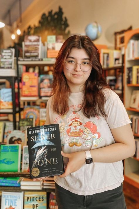 Staff pick! Meet Charlie (she/they), our newest bookseller at the Iguana. 🎉📖 Charlie’s rec is Silver in the Bone by Alexandra Bracken! About the book: #1 New York Times bestselling author Alexandra Bracken cements her status as one of the top fantasy authors writing today in this stunning series opener inspired by Arthurian legend and fueled by love, revenge, and pure adrenaline! Lore By Alexandra Bracken Fan Art, Lore Fanart Alexandra Bracken, Arthurian Legend, Fantasy Authors, Fantasy Books, Bestselling Author, Pure Products, Books