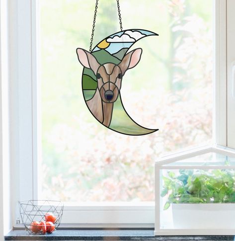 A stained glass pattern for a lovely forest scene with a deer standing in a forest landscape, shaped like a crescent moon. Stained Glass Deer, Custom Crafts, Diy Staining, Parts Of The Eye, Modern Stained Glass, Stained Glass Pattern, Deer Stand, Deer Pattern, Deer Art