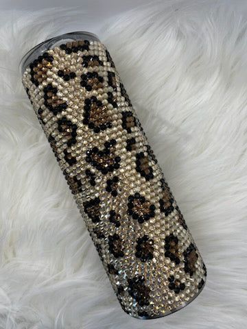 This 20 oz stainless steel tumbler with a Leopard print is an ideal accessory for any event. It is double wall vacuum insulated which will keep your drink hot or cold for an extended period of time. The exterior is adorned with shiny glass rhinestones for extra sparkle and shine. Make this fashionable tumbler your companion when you travel and you will be guaranteed a drink at the perfect temperature. Since each tumbler is crafted by hand and unique, please understand that there may be slight... Broken Arrow Oklahoma, Leopard Print Tumbler, Rhinestone Projects, Broken Arrow, A Drink, Tumblers With Lids, Stainless Steel Tumbler, Cheetah Print, Stainless Steel Tumblers