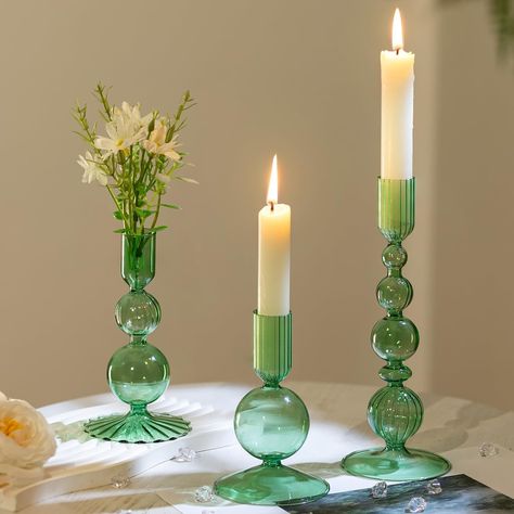 PRICES MAY VARY. Stylish Elegant Decoration: These candle holders for candlesticks feature a oblate spherical shape with elegant strips, adding a touch of delicate to any space. The multi-color allows you to blend with variety of candle colors, making them suitable for any season or decor style. Assorted Candleholder Set: This set features 3 vintage candlestick holders in varying shapes and sizes: measuring 4.72"/12 cm, 5.9"/15 cm, and 8.07"/20.5 cm in height. The candle sockets are 0.87"/2.2 cm Colored Glass Candlesticks, Tall Candle Holders Decor, Green Wedding Tablescape, Candle Stick Holders Decor, Green Wedding Centerpieces, Candle Colors, Decor For Table, Table Centerpiece Wedding, Green Candle Holders