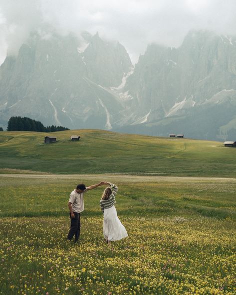 two lovers running through the meadows of the italian dolomites • • • keywords: documentary photography, cinematic photography, visual poetry, storytelling, love, couples photoshoot, tampa elopement, travel photographer, couples inspo, romcom, movie scenes, italy, dolomites, dolomites photos 🏷️ #floridaphotographer #tampaphotographer #stpeteweddingphptographer #tampaweddingphotographer #destinationweddingphotograoher #stpetephotographer #film #visualpoetry #cinematicphotographer #floridaw... Italian Dolomites Aesthetic, Dolomites Photoshoot, Film Couples Photography, Tibble Fork Reservoir Photography, Documentary Couple Photoshoot, Tampa Elopement, European Photography, Dolomites Elopement, Honeymoon Aesthetic