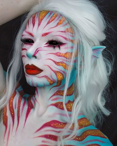 Reposted from @zorinblitzz  using our glitters for this Lionfish Siren // "What's your favourite fish?  I've had this idea for a while now after seeing a siren painting on pinterest so it was fun to finally put it together plus I haven't done a creature look in forever."  Used: Base: @mehronmakeup white colour cup @hudabeauty translucent powder Stripes: @mehronmakeup paradise paints @morphebrushes 35b Shadows: @nyxcosmetics rainbow palette @glitterrealmco luna vega @sugarpill love flamepoint hig