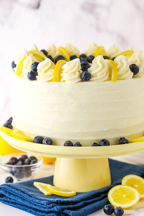 This Lemon Blueberry Layer Cake is bursting with fresh blueberries and lemon flavor. Topped with cream cheese frosting, this cake is perfect for Summer! #lemoncake #blueberrycake #summerdessert Lemon Blueberry Layer Cake, Blueberry Layer Cake, Lemon Birthday Cakes, Blueberry Lemon Cake Recipe, Lemon Blueberry Cake, Lemon Poppyseed Cake, Blueberry Cake Recipes, Gourmet Cakes, Recipe Cake