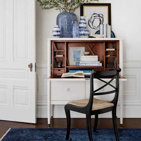 Searching for the perfect desk? Explore my roundup of the most gorgeous secretary desks that suit every style trend. The beautiful vintage inspired Wltllams Sonoma Home Lacourte Uprlght Desk really makes a statement in ivory (white) With nickel hardware. Don't you just love how they adorned the top of the desk with blue and white vases and a black and brass- framed print? I do too! Desks For Small Spaces, Mahogany Stain, Secretary Desk, Secretary Desks, Best Desk, Williams Sonoma Home, A Desk, Office Chairs, Home Office Design