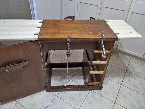 I came across a 1959 sewing cabinet (minus the machine) online for $15.So I picked it up and gave it a makeover, to be used as extra storage and surface space.   The veneer on the cabinet top was damaged. And when you opened up/folded back the top, there was a big hole, where the sewing machine sat originally.     So the first thing I did was go to Home Depot and buy pine wood and have them cut it to the exact same sizes as the two original fold out pieces.   Then I remo… Sewing Cabinet Makeover, Old Sewing Cabinet, Sewing Table Repurpose, Go To Home, Muskoka Chair, Sewing Machine Cabinet, Cabinet Top, Sewing Machine Table, Update Cabinets