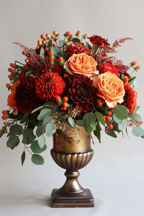 Add elegance and personality to your wedding with floral centerpieces, a timeless decor choice. See more inspiration here. Orange And Green Floral Arrangements, Terracotta Wedding Centerpieces, November Wedding Centerpieces, Green Floral Arrangements, Contemporary Wedding Decor, Wedding Flower Arrangements Fall, Woodland Wedding Centerpieces, Vase Flower Arrangements, Wedding Centerpiece Ideas