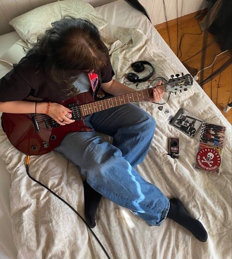 guitar Guitar Leaning Against Wall, Someone Holding A Guitar, Musical Senior Pictures, Learning Guitar Aesthetic, Electric Guitar Photoshoot, Electric Guitar Pose, Bass Photoshoot, Guitar Photoshoot Ideas, Poses With Guitar