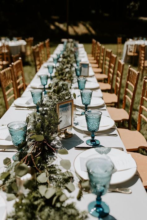 forest wedding water glass Eucalyptus And Blue Wedding Table Decor, Hop Wedding Decor, Blue Grey Green Wedding Colors, Colored Water Goblets Wedding, Dusty Blue And Sea Glass Wedding, Ice Blue And Sage Green Wedding, Blue Glass Wedding Centerpieces, Dusty Blue And Sage Green Outdoor Wedding, Light Blue And Greenery Wedding