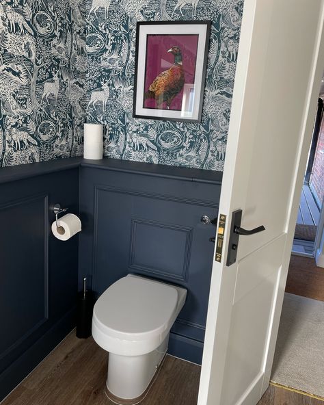 Bathroom Wallpaper & panelling inspo. Follow for more ideas #wallpaper #panelling #downstairsloo #bathroom #interiordesign #interiordesignideas Blue Cloakroom Toilet Ideas, Panelled Powder Room, Wallpapered Cloakroom Downstairs Loo, Bathroom Door Panelling, Navy Downstairs Toilet Ideas, Panelled Wc Ideas, Wc Ideas Downstairs Loo Panelling, Quirky Cloakroom Toilet Ideas, Downstairs Toilet Ideas Navy